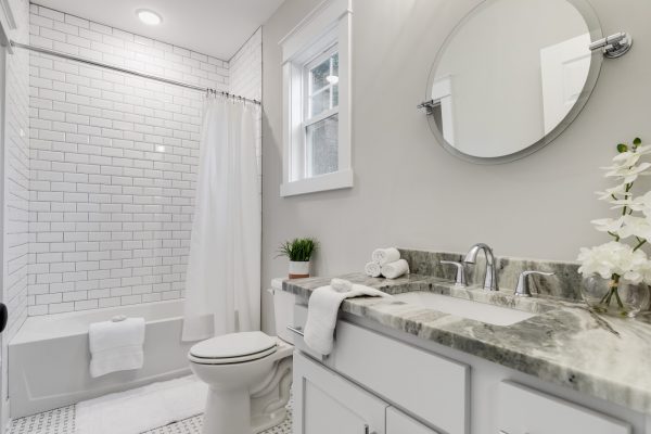 Guest bathroom with subway tile shower in home by Richmond Hill Design-Build