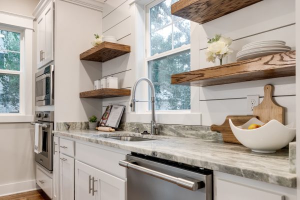 Beautiful, updated kitchen with white cabinetry and countertops