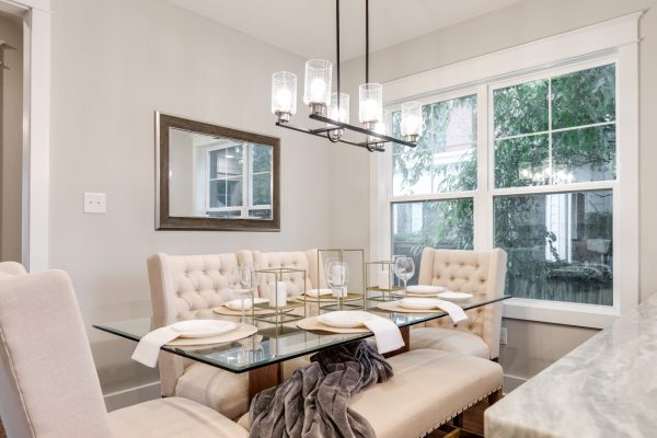 Dining area with unique chandelier in home built by Richmond Hill Design-Build