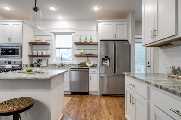 Gorgeous kitchen with floating shelves in home built by Richmond Hill Design-Build