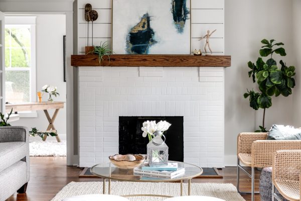 White, painted brick fireplace in beautiful home built by Richmond Hill Design-Build