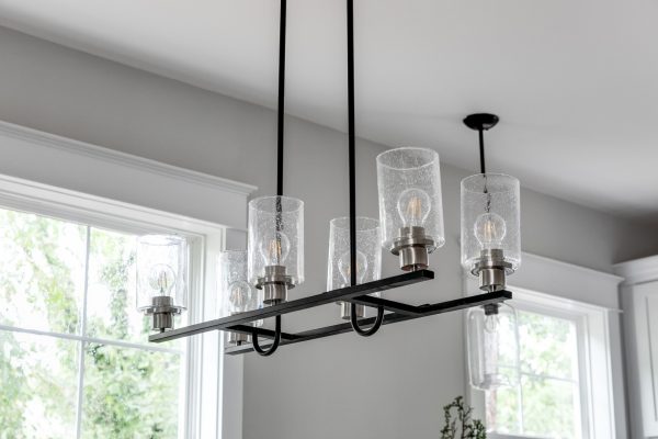 6-light chandelier in dining room in home built by Richmond Hill Design-Build