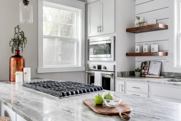 Beautiful, updated kitchen with white cabinetry and countertops built by Richmond Hill Design-Build