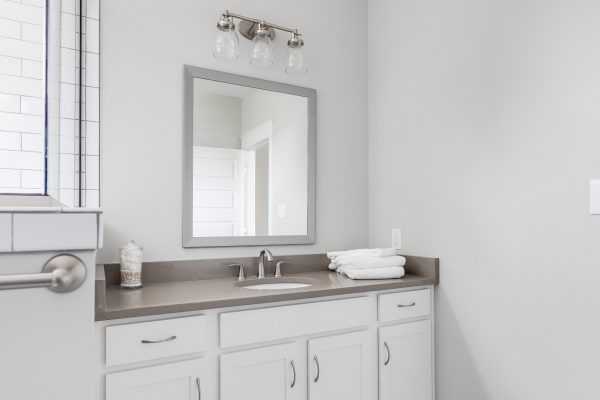 White vanity in bathroom in renovated home by Richmond Hill Design-Build