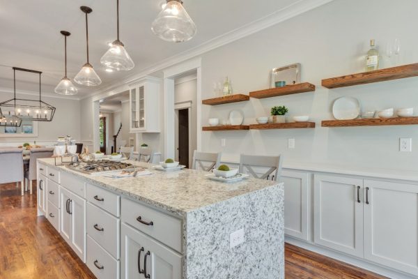 Island and floating wood shelving in beautiful kitchen by Richmond Hill Design-Build