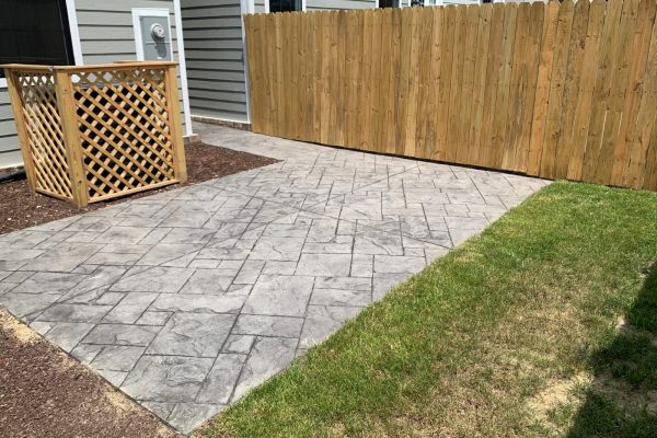 Rear fenced yard and patio of townhome by Richmond Hill Design-Build