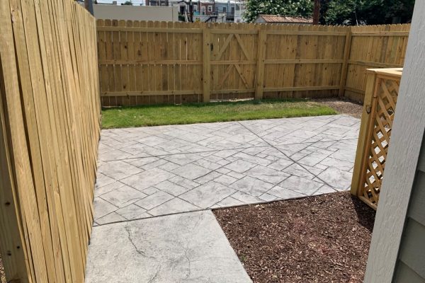 Rear fenced yard and patio of townhome by Richmond Hill Design-Build