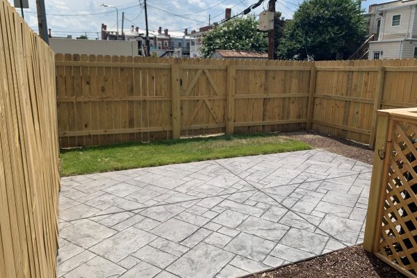 Rear fenced yard and patio of townhome by Richmond Hill Design-Build