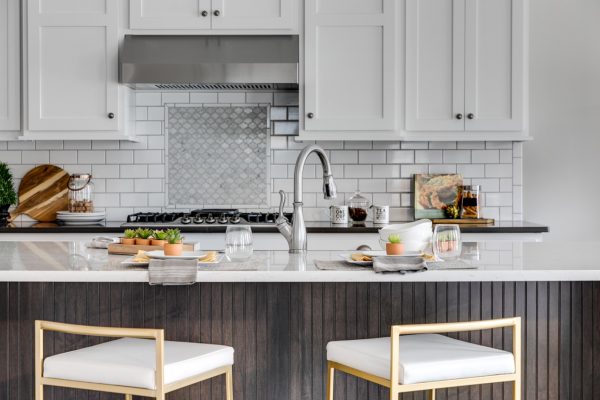 Kitchen with subway tile backsplash in new home built by Richmond Hill Design-Build