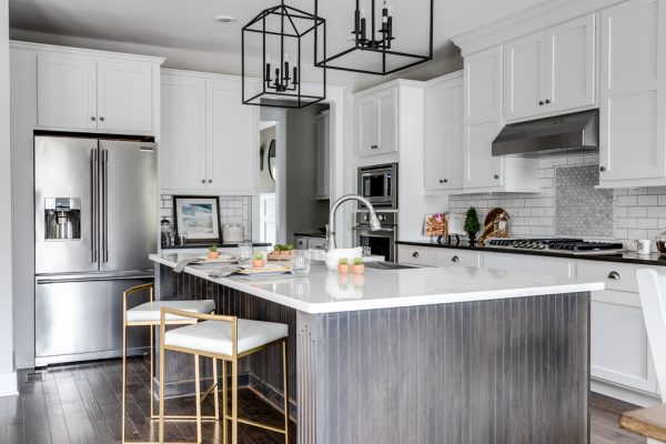 Kitchen with island and pendant lights in new home built by Richmond Hill Design-Build