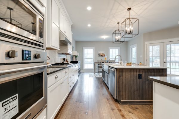 Kitchen with wood floors in new home built by Richmond Hill Design-Build