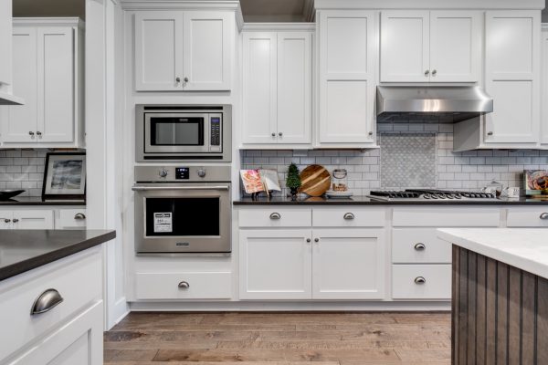 Kitchen with white cabinetry in new home built by Richmond Hill Design-Build