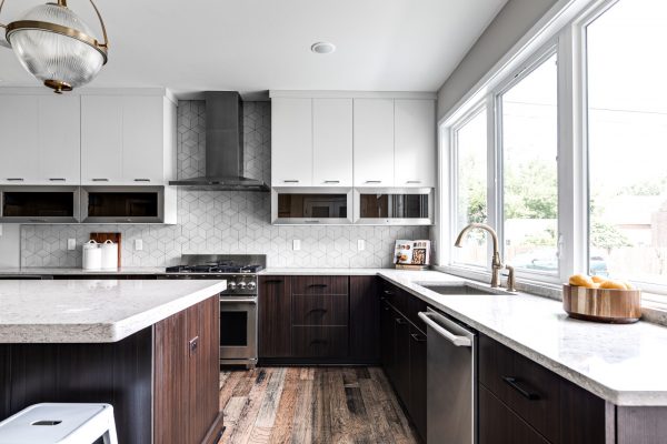 Stunning kitchen with white cabinetry in new contemporary home by Richmond Hill Design-Build