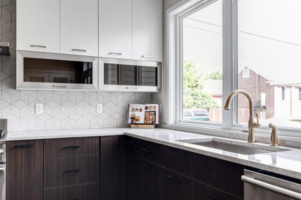 Stunning kitchen with white cabinetry in new contemporary home by Richmond Hill Design-Build