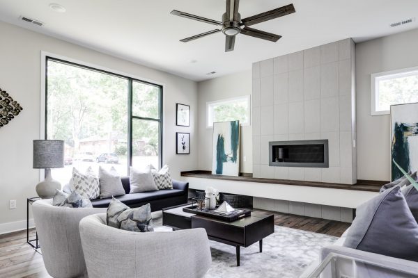 Stunning family room with linear fireplace in new contemporary home by Richmond Hill Design-Build