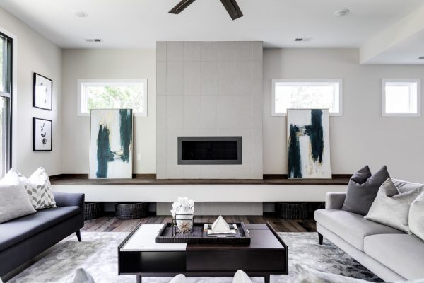 Family room with linear fireplace in new contemporary home by Richmond Hill Design-Build