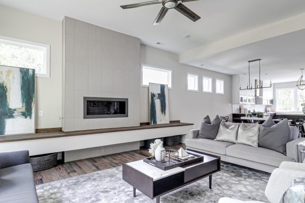 Stunning family room with linear fireplace in new contemporary home by Richmond Hill Design-Build