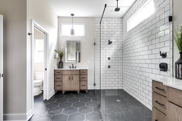 Gorgeous owner's bathroom with oversized shower in new contemporary home by Richmond Hill Design-Build