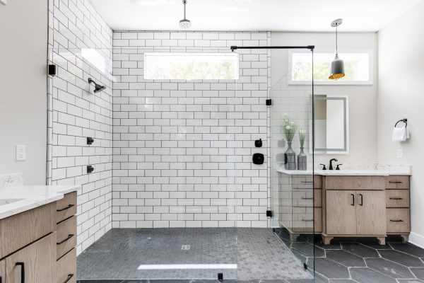 Gorgeous owner's bathroom with oversized shower in new contemporary home by Richmond Hill Design-Build