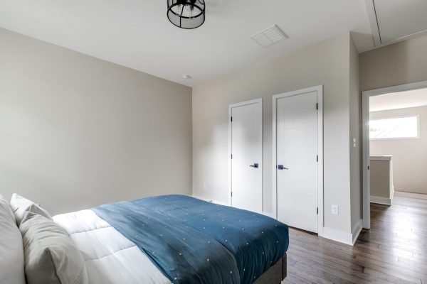 Guest bedroom in new contemporary home by Richmond Hill Design-Build