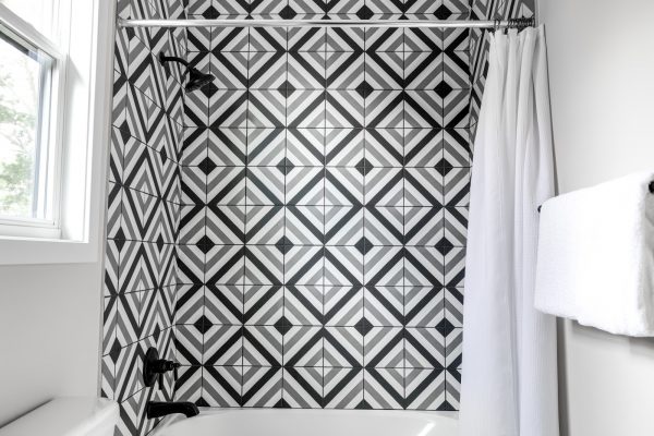 Tile shower wall in new contemporary home by Richmond Hill Design-Build