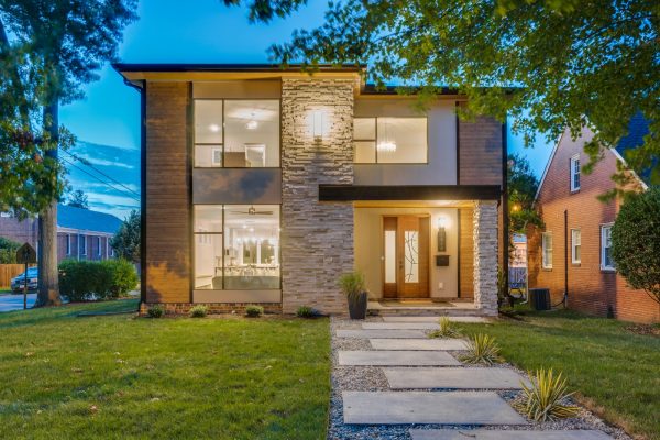 Stunning twilight photo of exterior of new contemporary home by Richmond Hill Design-Build