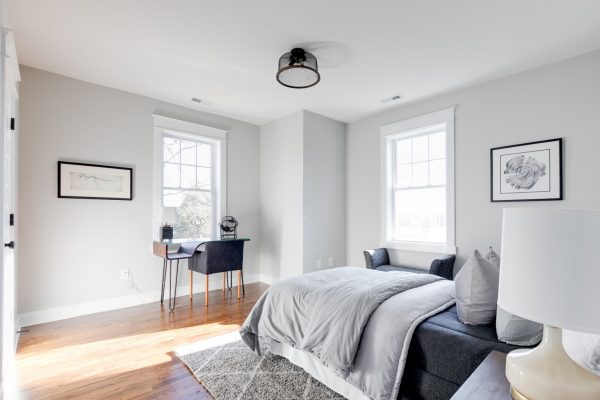 Guest bedroom in renovated Dutch Colonial home by Richmond Hill Design-Build