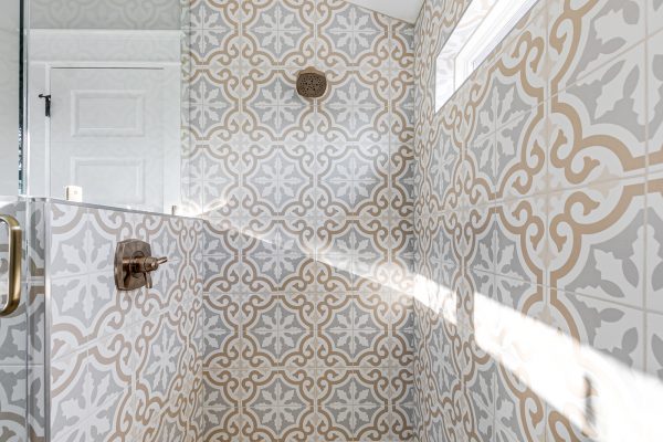 Gorgeous shower in owner's bathroom in renovated Dutch Colonial home by Richmond Hill Design-Build