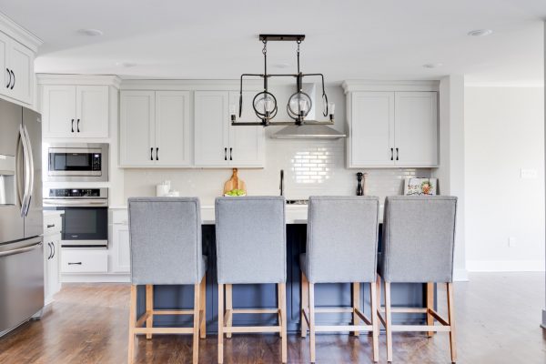 Two-toned kitchen cabinetry in renovated home by Richmond Hill Design-Build