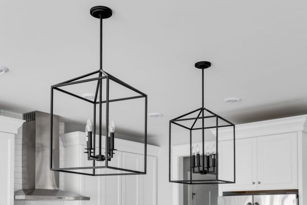 Cage pendant lights in kitchen in home built by Richmond Hill Design-Build