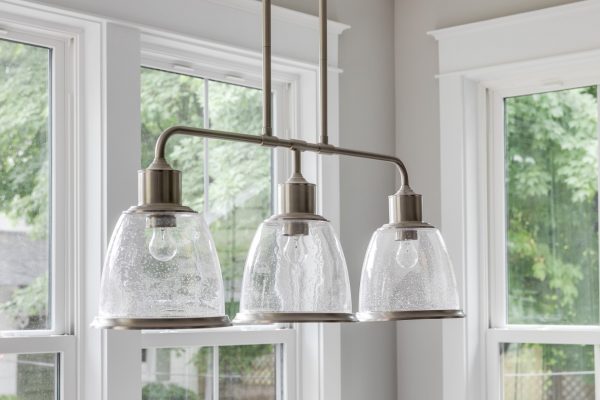 Linear pendants in breakfast area in home built by Richmond Hill Design-Build