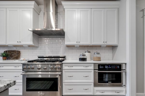 Kitchen with stainless steel appliances and island in home built by Richmond Hill Design-Build