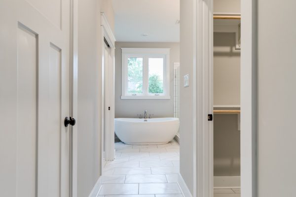 Beautiful owner's bathroom with freestanding tub in renovated home by Richmond Hill Design-Build