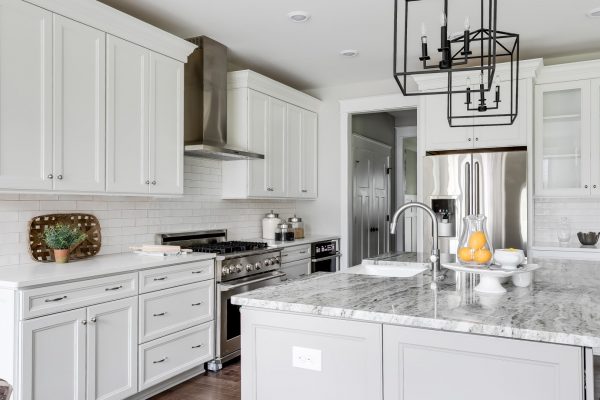 Kitchen with stainless steel appliances and island in home built by Richmond Hill Design-Build