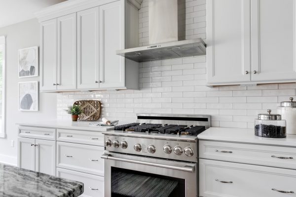 Kitchen with stainless steel appliances and island in home built by Richmond Hill Design-Build