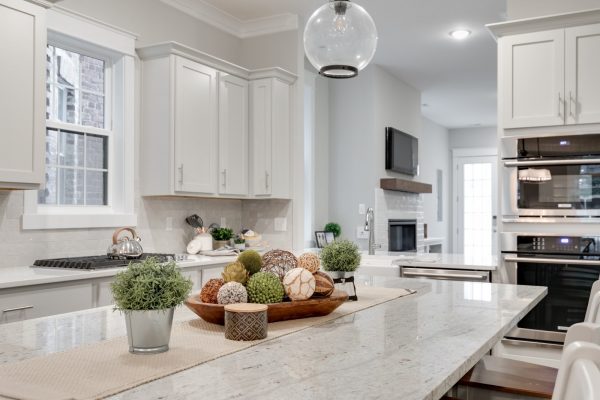 Kitchen island with pendant lights in new townhouse by Richmond Hill Design-Build