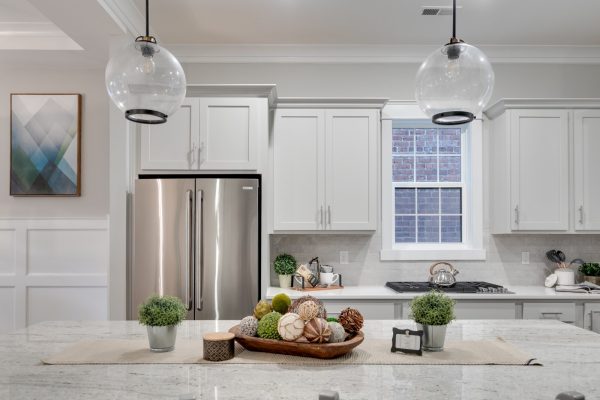 Pendant lights over island in kitchen of new townhouse by Richmond Hill Design-Build