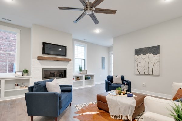 Family room with linear fireplace in new townhouse by Richmond Hill Design-Build