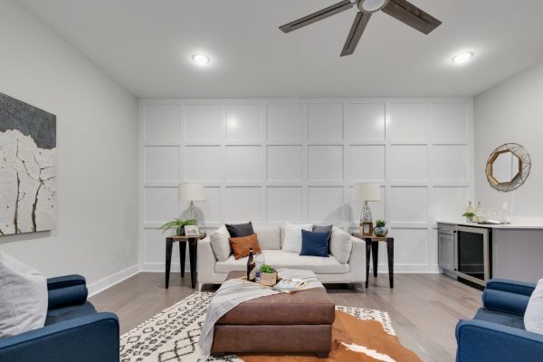 White wainscotted wall in family room of new townhouse by Richmond Hill Design-Build