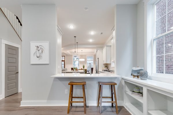 Eat at bar with stools in new townhouse by Richmond Hill Design-Build