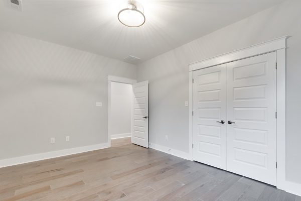 Guest bedroom in new townhouse by Richmond Hill Design-Build