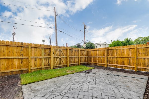 Rear fenced yard of townhouse by Richmond Hill Design-Build