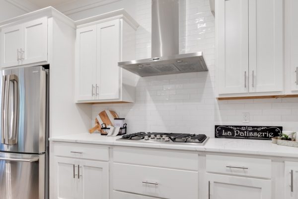 Range hood and cook top of kitchen in new townhouse by Richmond Hill Design-Build