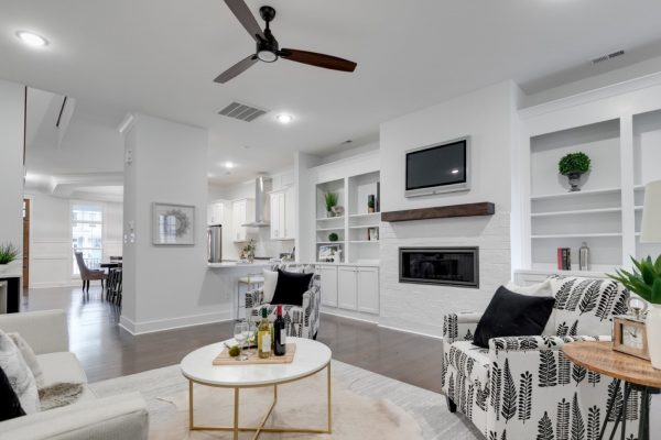 Beautiful family room with linear fireplace in new townhouse by Richmond Hill Design-Build