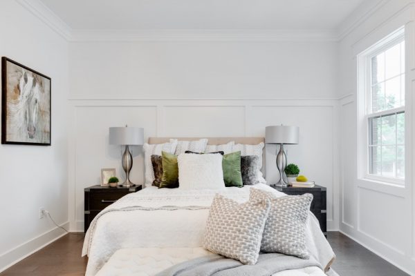 Beautiful bed in owner's bedroom in new townhouse by Richmond Hill Design-Build