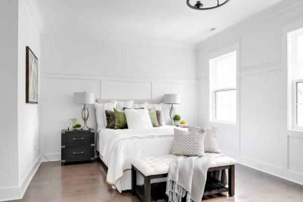 Beautifully dressed bed in owner's bedroom in new townhouse by Richmond Hill Design-Build