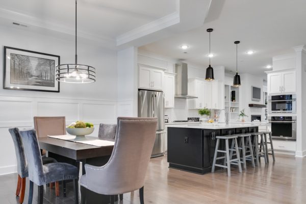 Dining area and kitchen of new townhome by Richmond Hill Design-Build