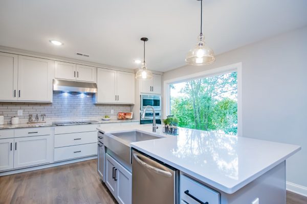 Gorgeous kitchen with island in renovated ranch home on Lake Cherokee by Richmond Hill Design-Build