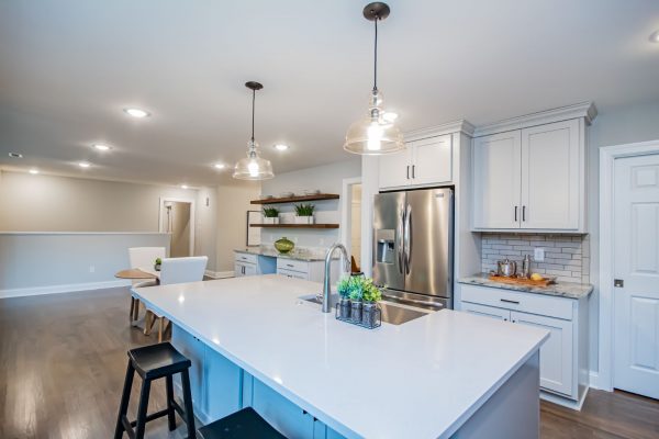 Gorgeous kitchen with island in renovated ranch home on Lake Cherokee by Richmond Hill Design-Build