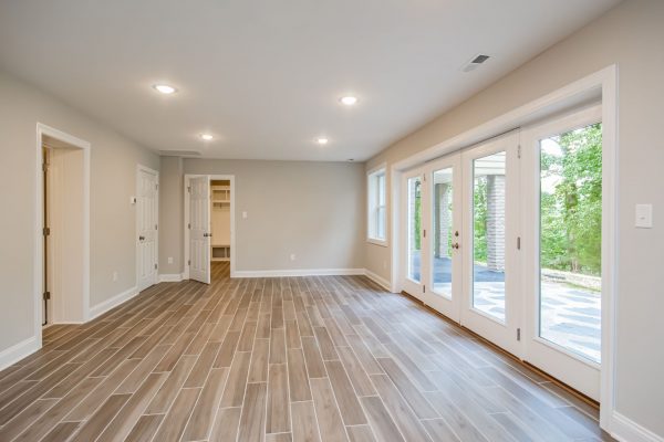 Rec room with lake access in gorgeous renovated ranch home by Richmond Hill Design-Build